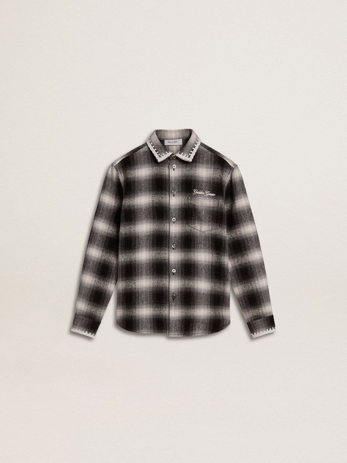 0739e07926666fb71f871bbd47a01becf38350246e68d298283e64cf123ad703 Kids' black and white checked shirt with white embroidery - Image 1