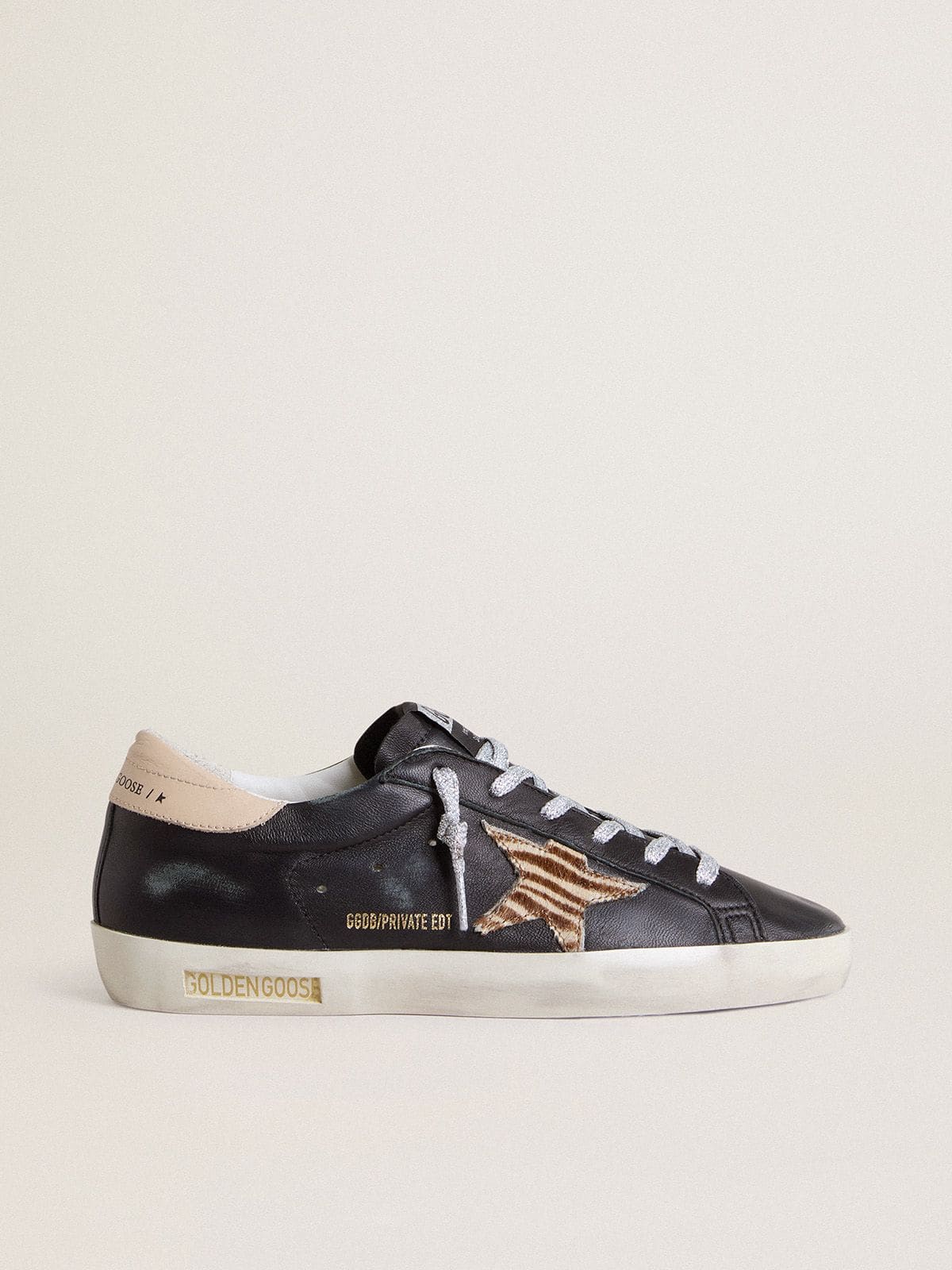 0f83d7d728e20cd7d8d929477d1f450c6db18c93442e8765aab38f02a33d7427 Women's Super-Star in black nappa leather with zebra-print pony skin star and beige leather heel tab - Image 1