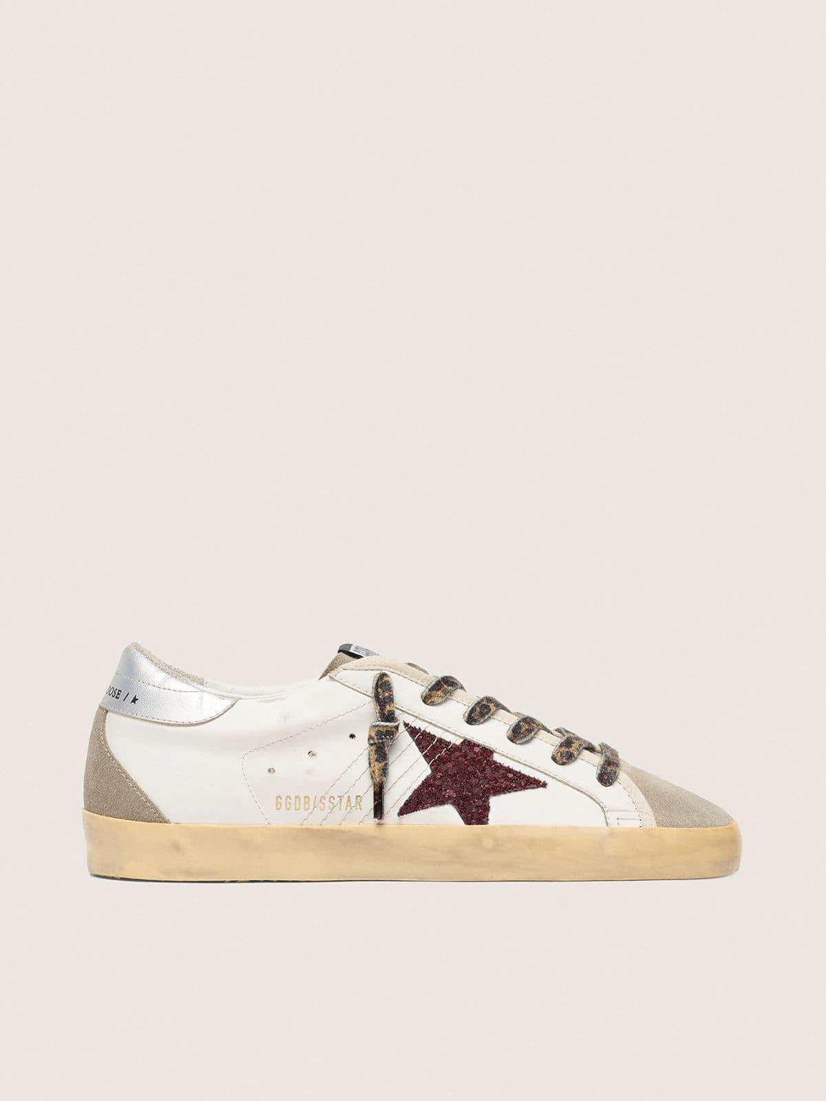 124f00338f99b209de321c57f05ec883c41f2efe2eb92cbcc9a544f71a8878e0 Super-Star with burgundy glitter star and silver heel tab - Image 1