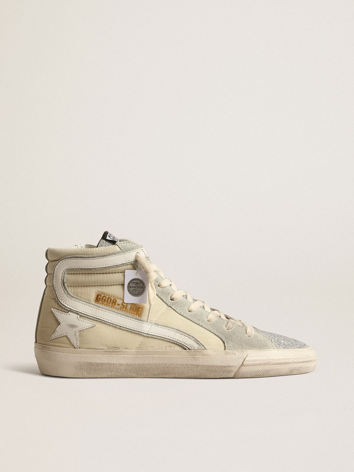 15565fe8a978aabf4ab98f0a8f65ed749548cab8c43d51dd04cb9ad7315b7294 Slide in ivory nylon with white leather star and Swaroski tongue - Image 1