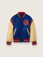 Men's blue varsity bomber jacket with beige leather sleeves