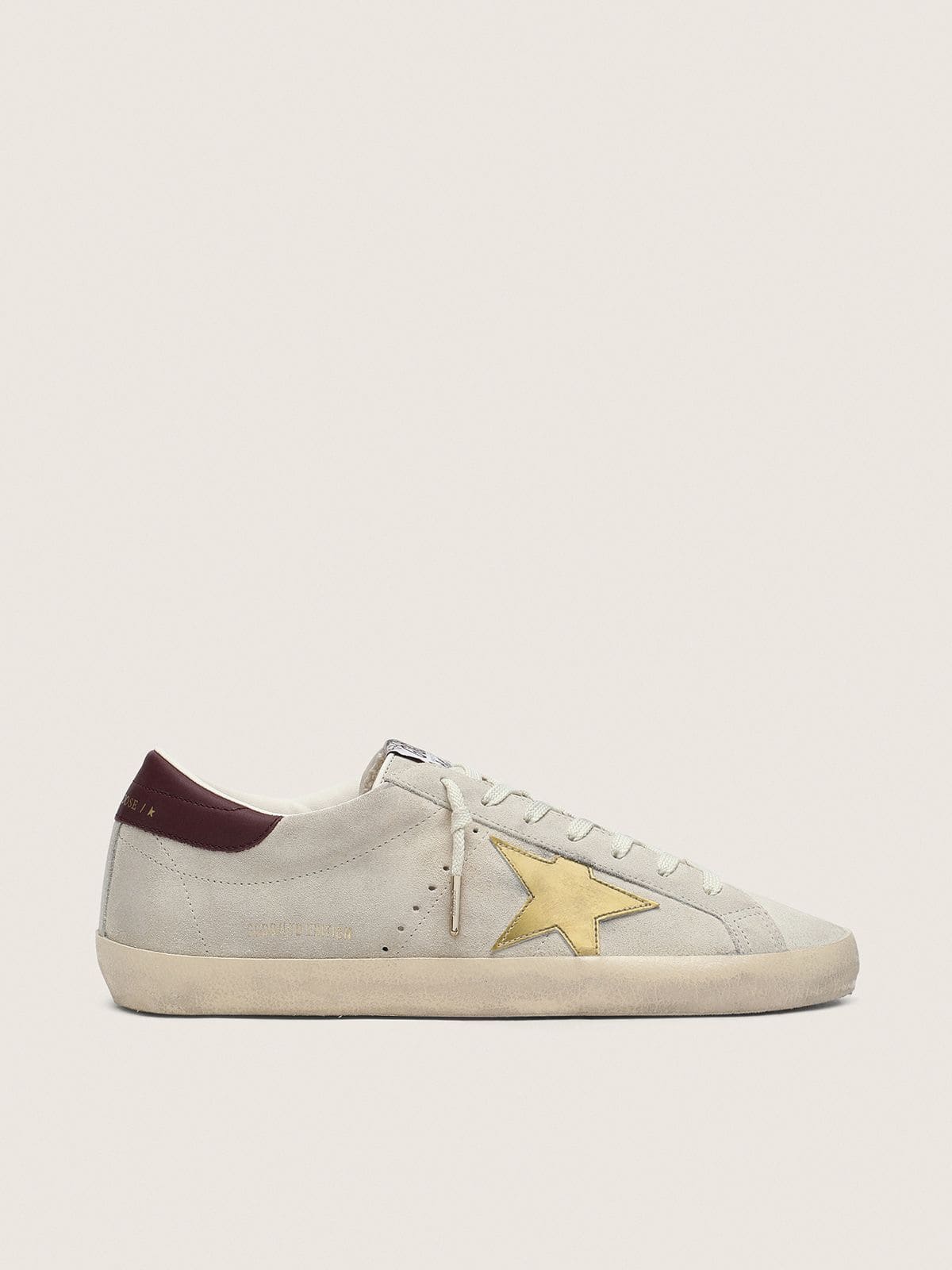 2aafceb0512630258993c3c86cf78553301ebab607d22948b38f102aefb96412 Women's Super-Star CNY in ivory suede with metallic leather star and leather heel tab - Image 1