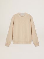 Women's beige sweater with 'Golden' lettering on the back