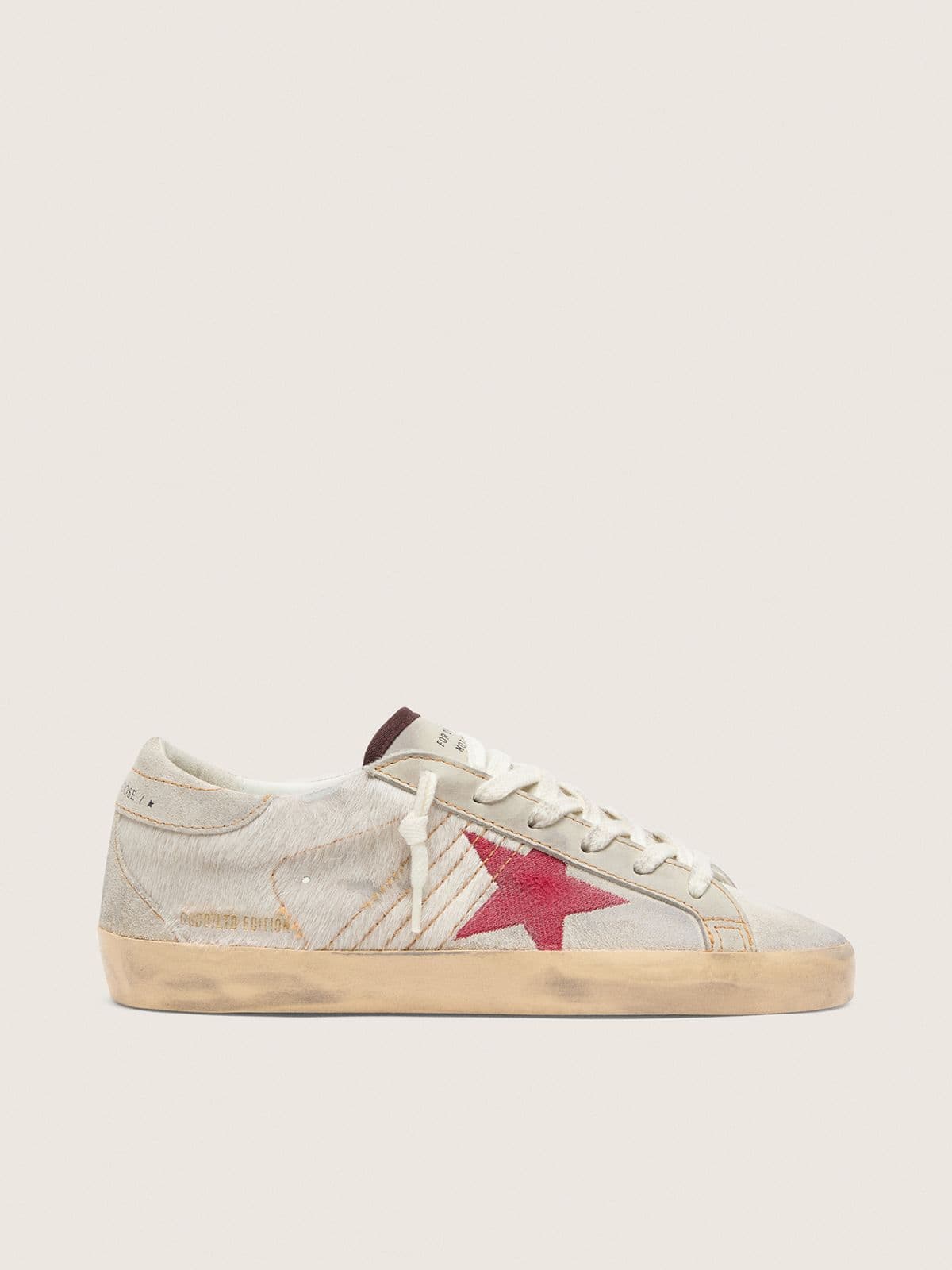 4100eced8fd3313301c0a523cf31ea9fa9581a768ffea3a6e9bd31ccd46a8ddd Women's Super-Star LTD in white pony skin with red suede star - Image 1