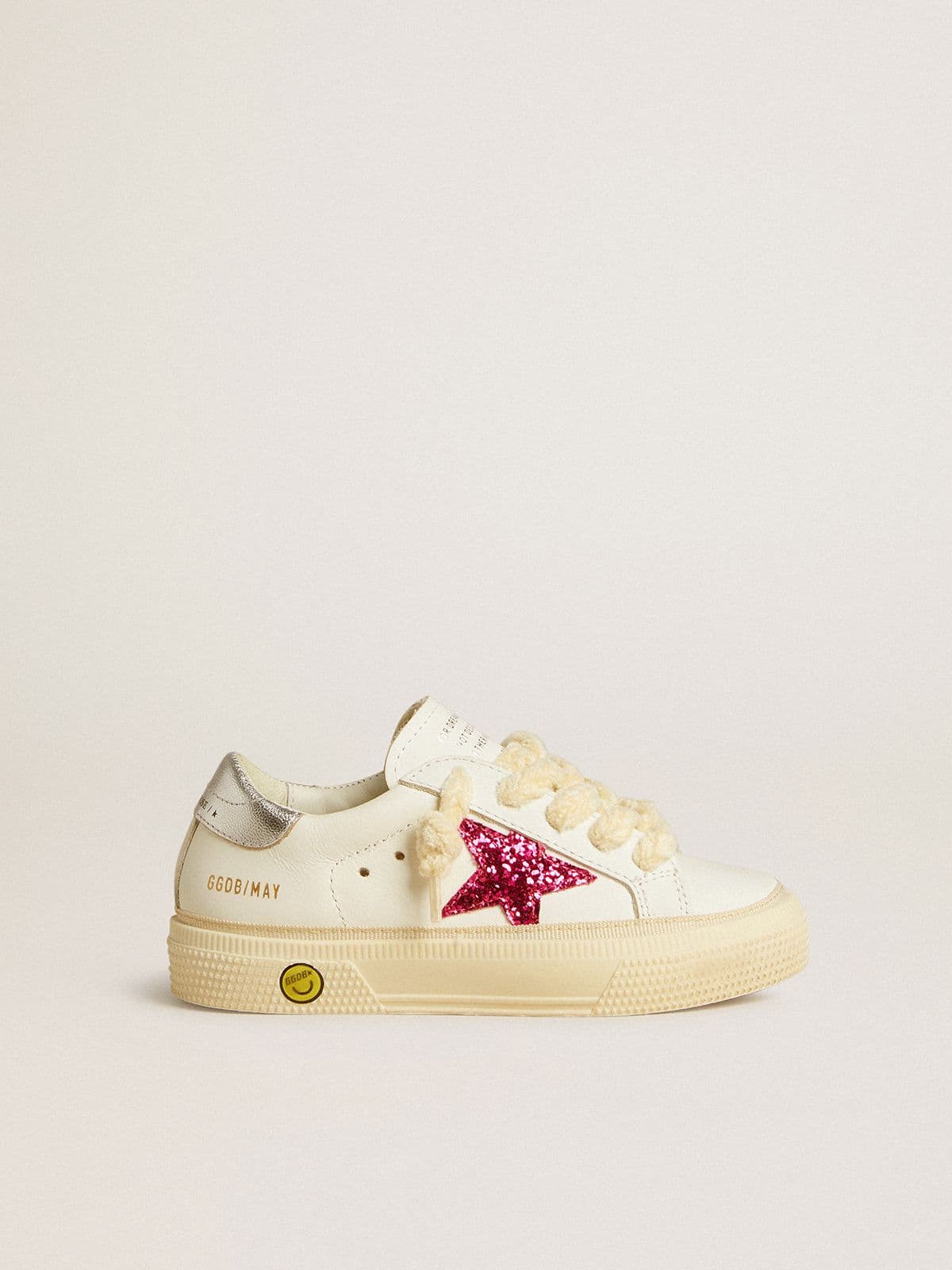 41e1b5c222fa386b2e92f744e75c28ff1fae82ac6eda2895fc56f03e34ad0383 May Young with fuchsia glitter star and metallic leather heel tab - Image 1