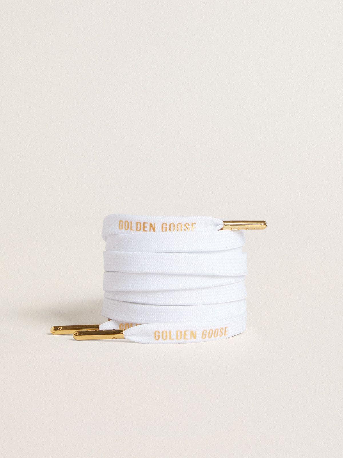 4ea4b076c2d771729fe188151f8ca58cd1a0b4a9b9b8a33d857af20802b1d214 White cotton laces with contrasting gold logo - Image 1
