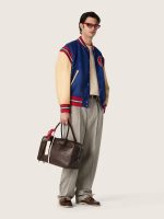 Men's blue varsity bomber jacket with beige leather sleeves - Image 3