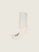Cream-colored socks with distressed details and rhinestones