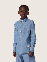 Journey unisex shirt in light blue cotton chambray with fringed hem and embroidered patch - Image 5