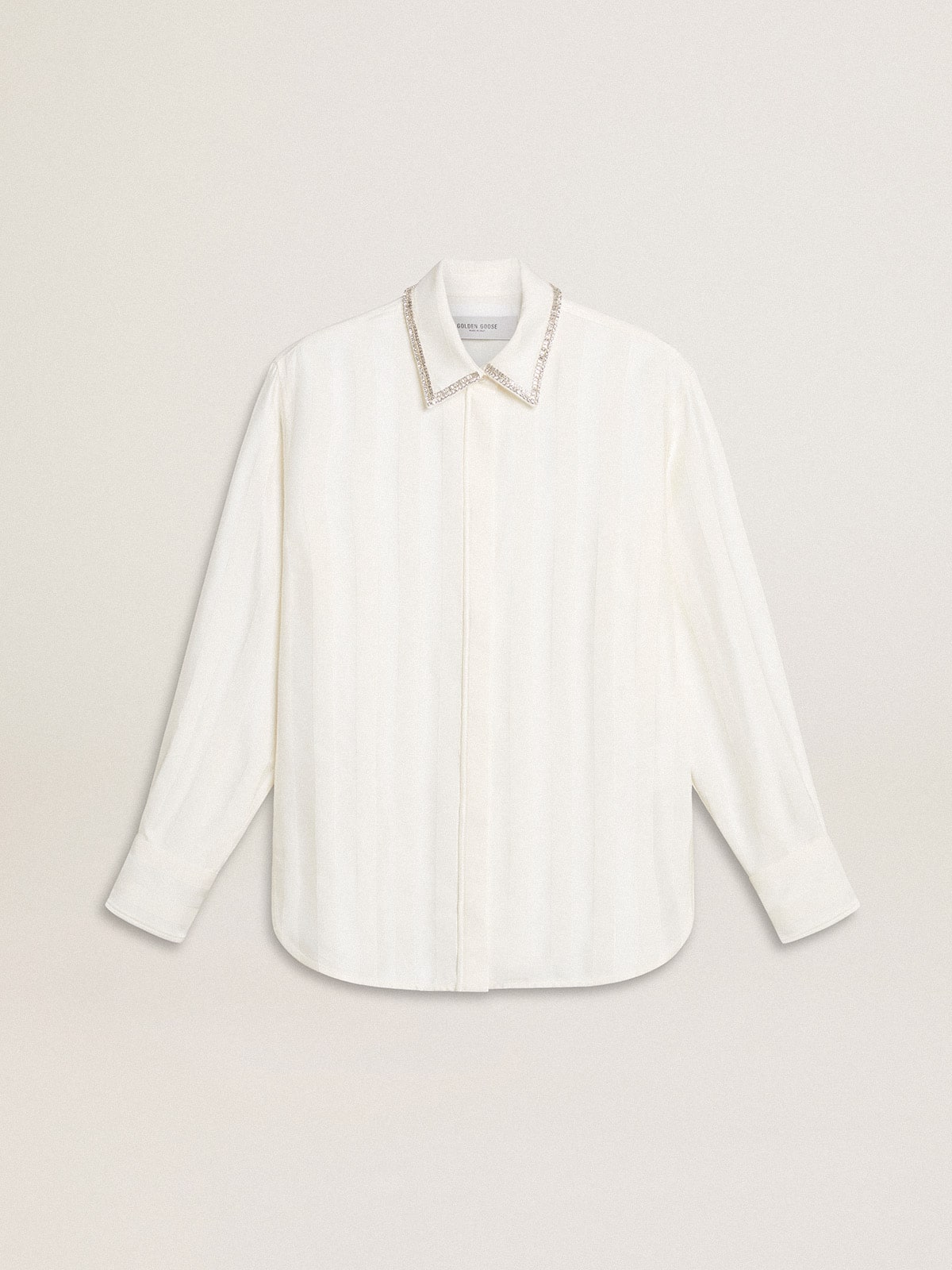 5eb6b667607e7330ca76113b61b6e289f430bf55e08567b50a72351085eceee8 Women's shirt with a vertical striped pattern and crystal embroidery - Image 1