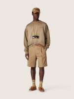 Khaki-colored socks with distressed details and dark green and white stripes - Image 3