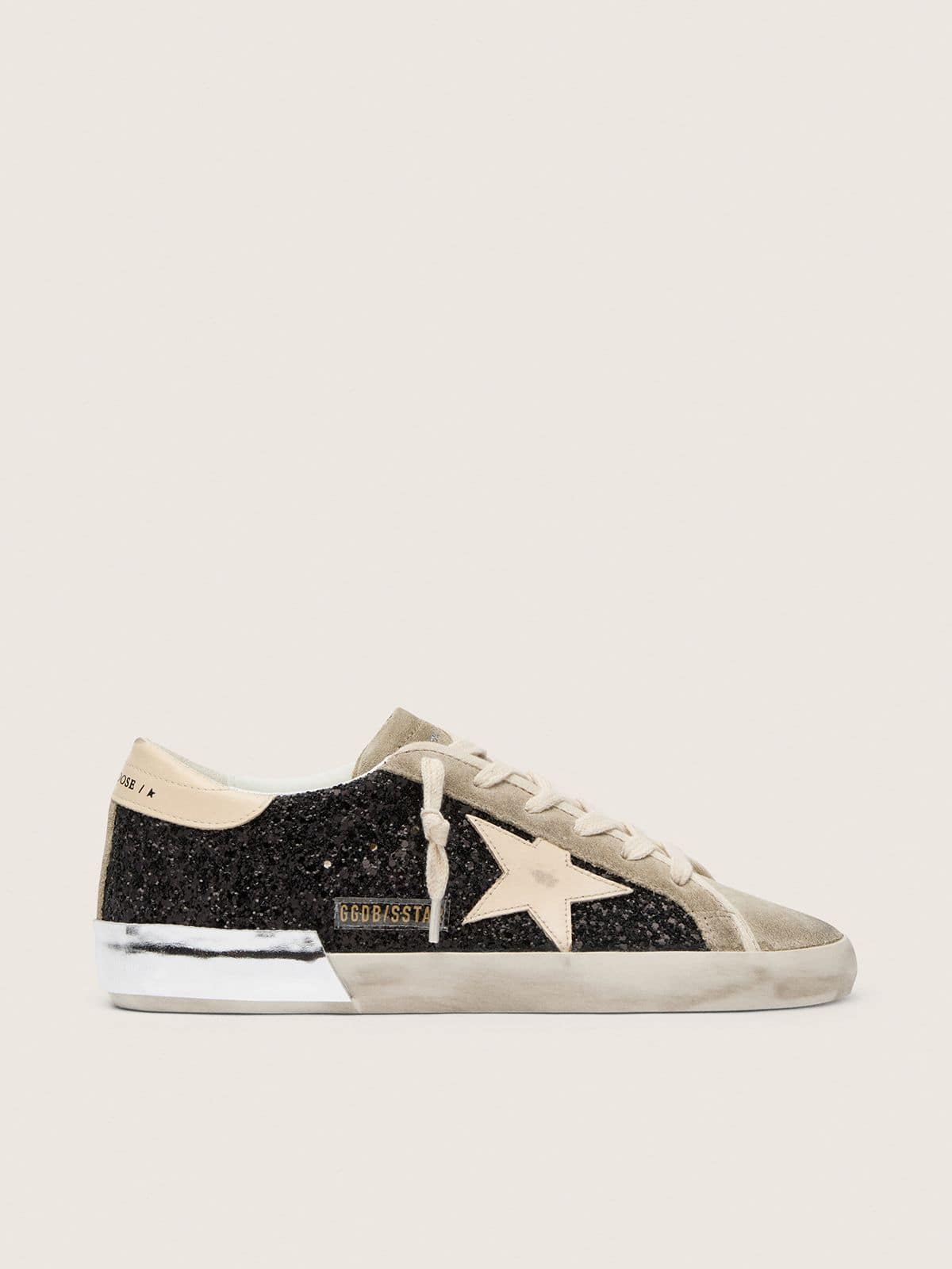 5fb6afd99f5245bea1e5a6bb92024cc3baceb2a0751284b9562d82db7c529842 Super-Star in black glitter with cream star and suede inserts - Image 1