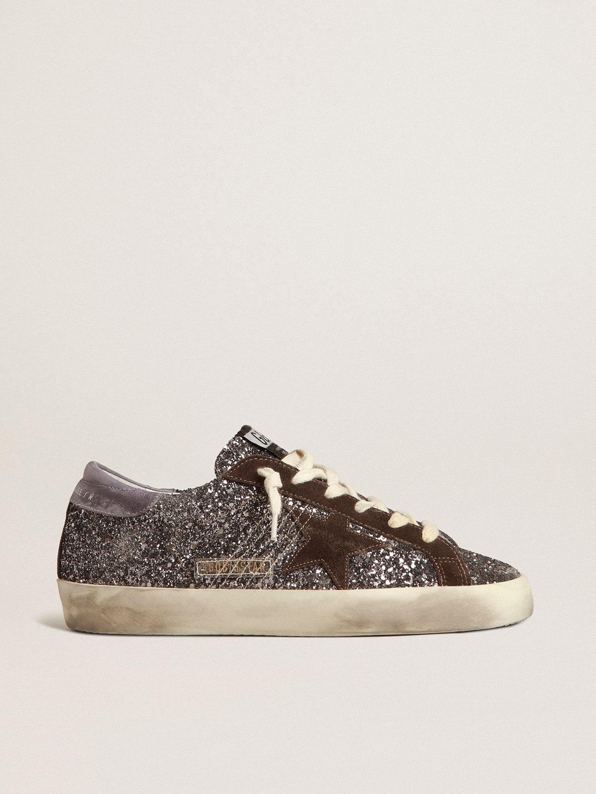 632a396e8c09bb9fe410cec4dcf30c4a36391212447acc636ddcafe936641000 Super-Star in glitter with a brown star and lilac heel tab - Image 1