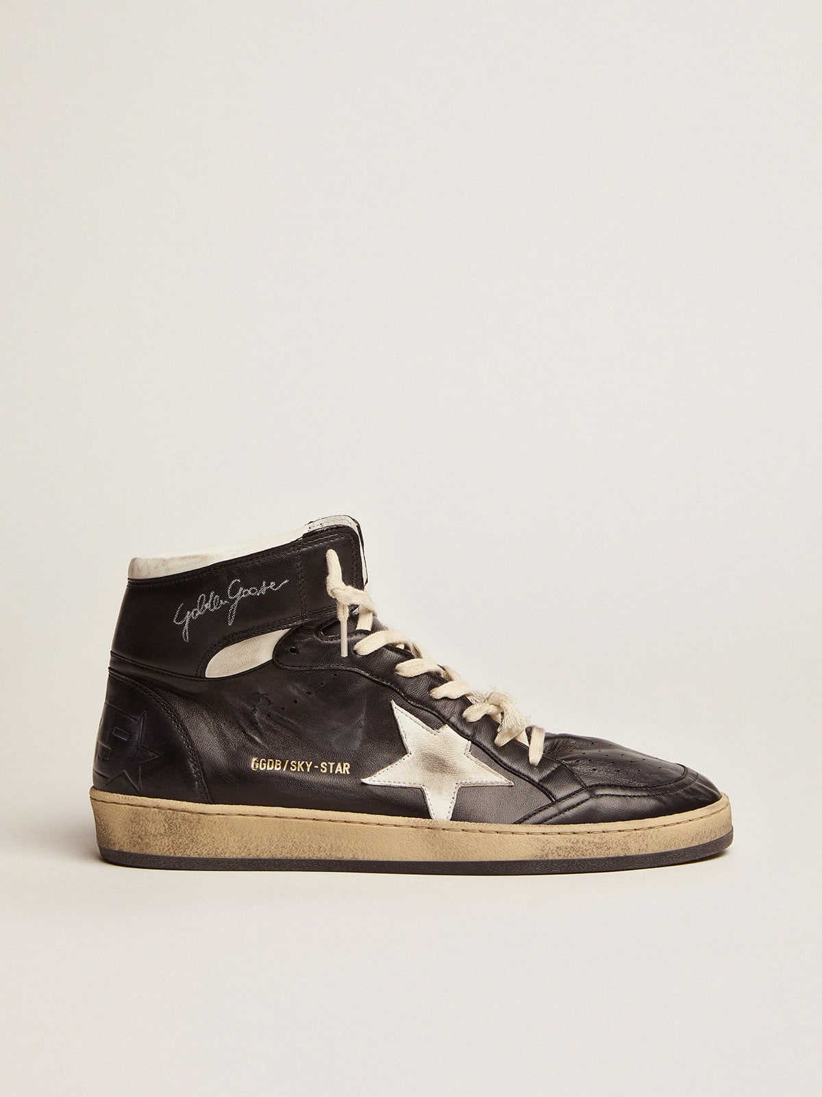 64ad7280235ac0fc563aefe07d6bb904b7b3d1996bc1351bf0bb2013ba9a26ab Sky-Star in black nappa leather with white leather star - Image 1