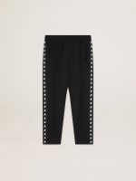 Men's black joggers with white stars on the sides