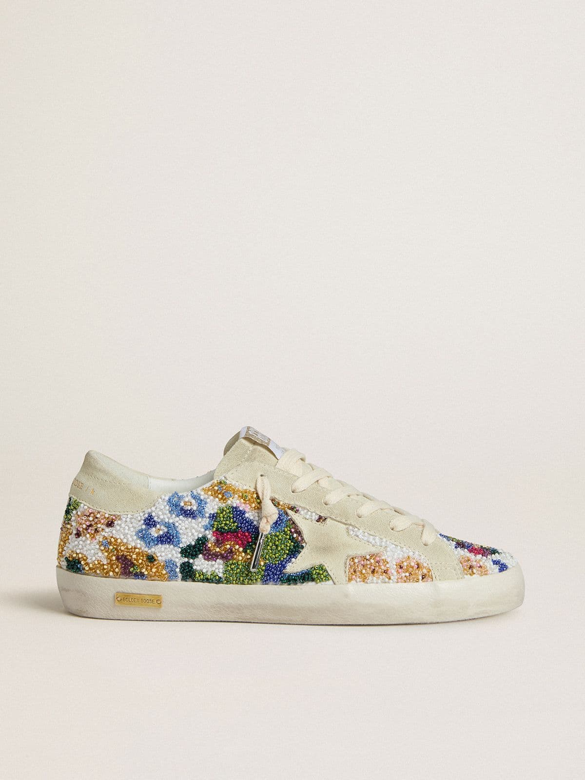 68d80268f120f6e2e02d1c29d92c5c79e3d14e11f88a0d311d9f1e62f79908eb Women's Super-Star with multicolored beads and beige suede star - Image 1
