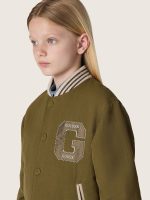 Journey unisex bomber jacket in military-green nylon twill with embroidered patch - Image 5