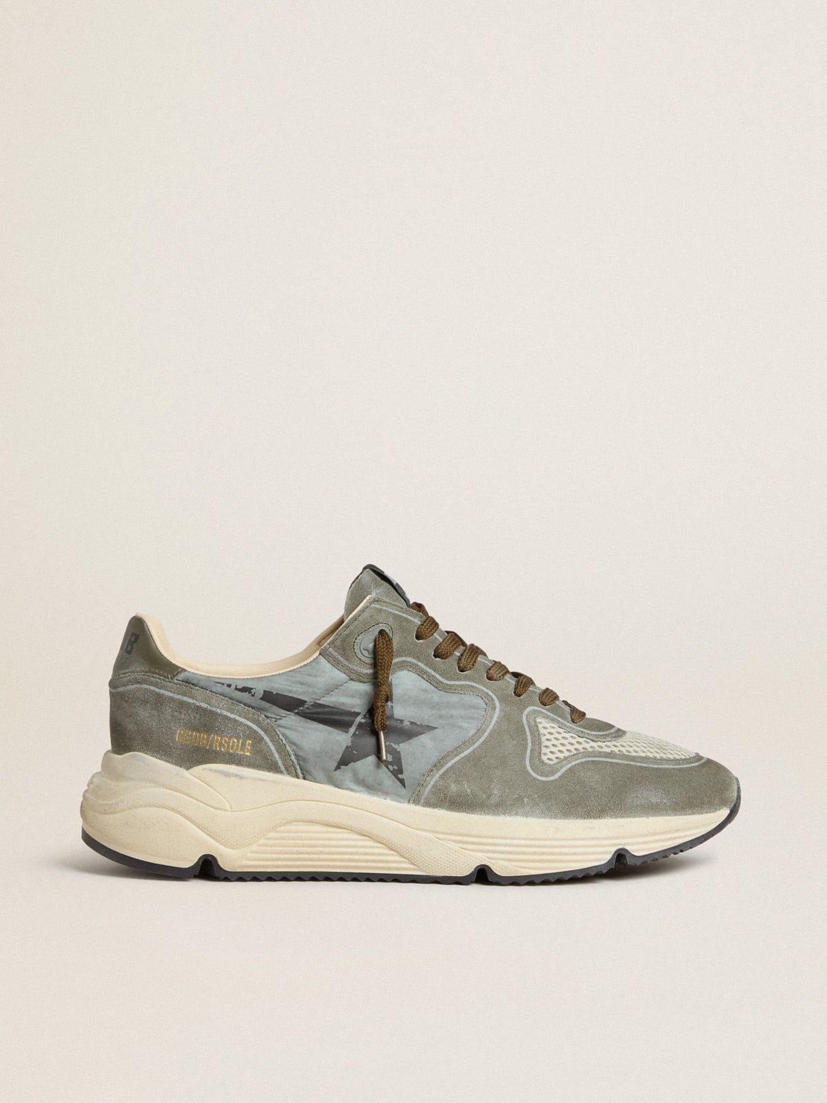 7de8bc4250f517ab90bbb3bd448bea835948f6b624be68d95910ee953db194b7 Men's Running Sole in light blue nylon with black star and green leather heel tab - Image 1