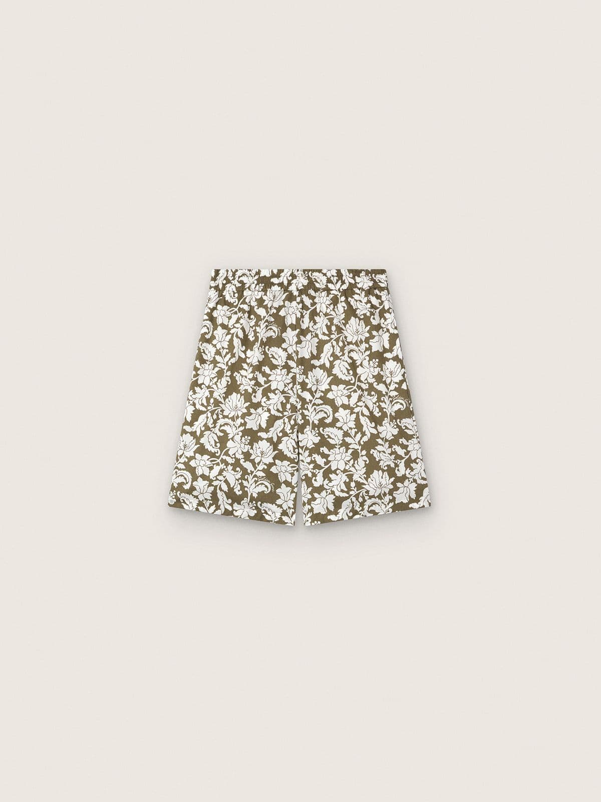 7ed8c013bfd77faf18254fecc2a6d2156e4562073c8f6b069de42d71e2136777 Journey boys' cotton canvas shorts with green and white floral print - Image 1