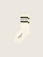 Cotton socks with distressed finishes, green stripes and black logo