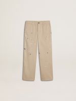 Kids' beige chino pants with multicolor splashes