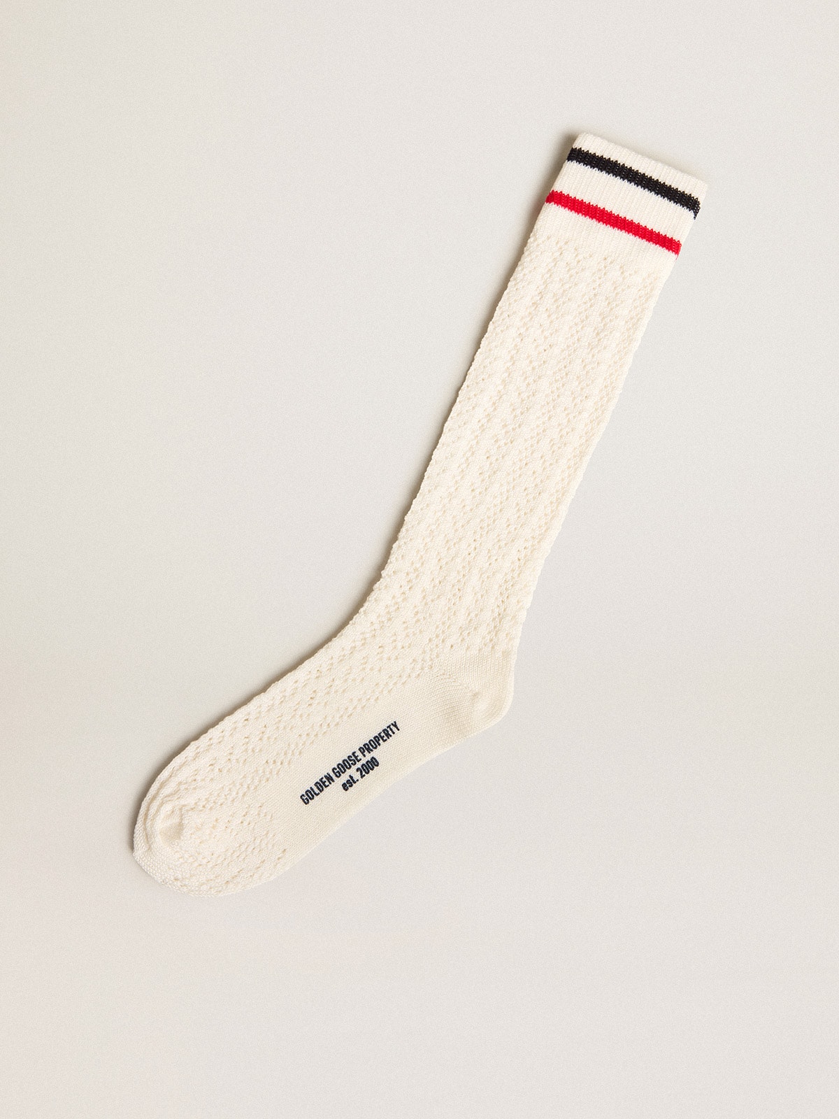 9441a344f21efd0e3f3389b1c9c15c2428bc75416da342c19a0a49fb6e22a864 Long ribbed socks in vintage white with two-tone stripes - Image 1