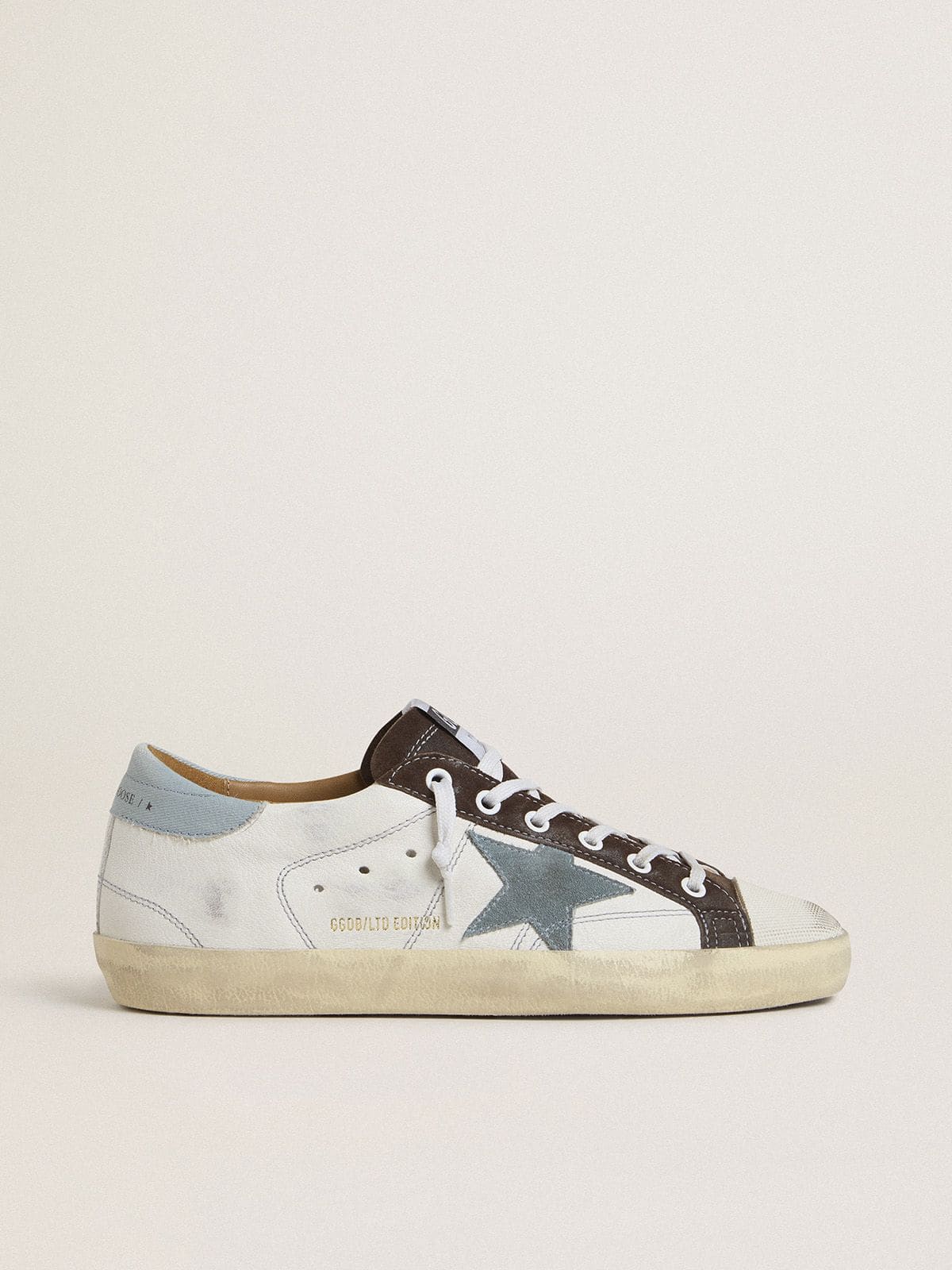 94b5f94b530f9a53481704b9ad16e2b053dd7bcd5372f56c02d42072b599d354 Women's LTD Super-Star with light blue suede star and light blue canvas heel tab - Image 1