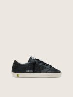 Young Super-Star in black leather with black glitter star