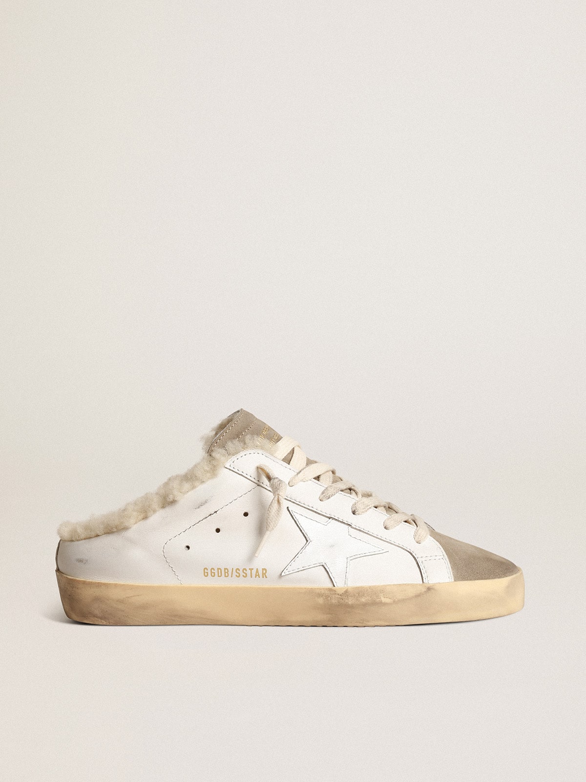 a1d888702f28744039e5aa1b2e60963586a0841bf13b4896b606df00483d0477 Super-Star Sabots with white leather star and shearling lining - Image 1