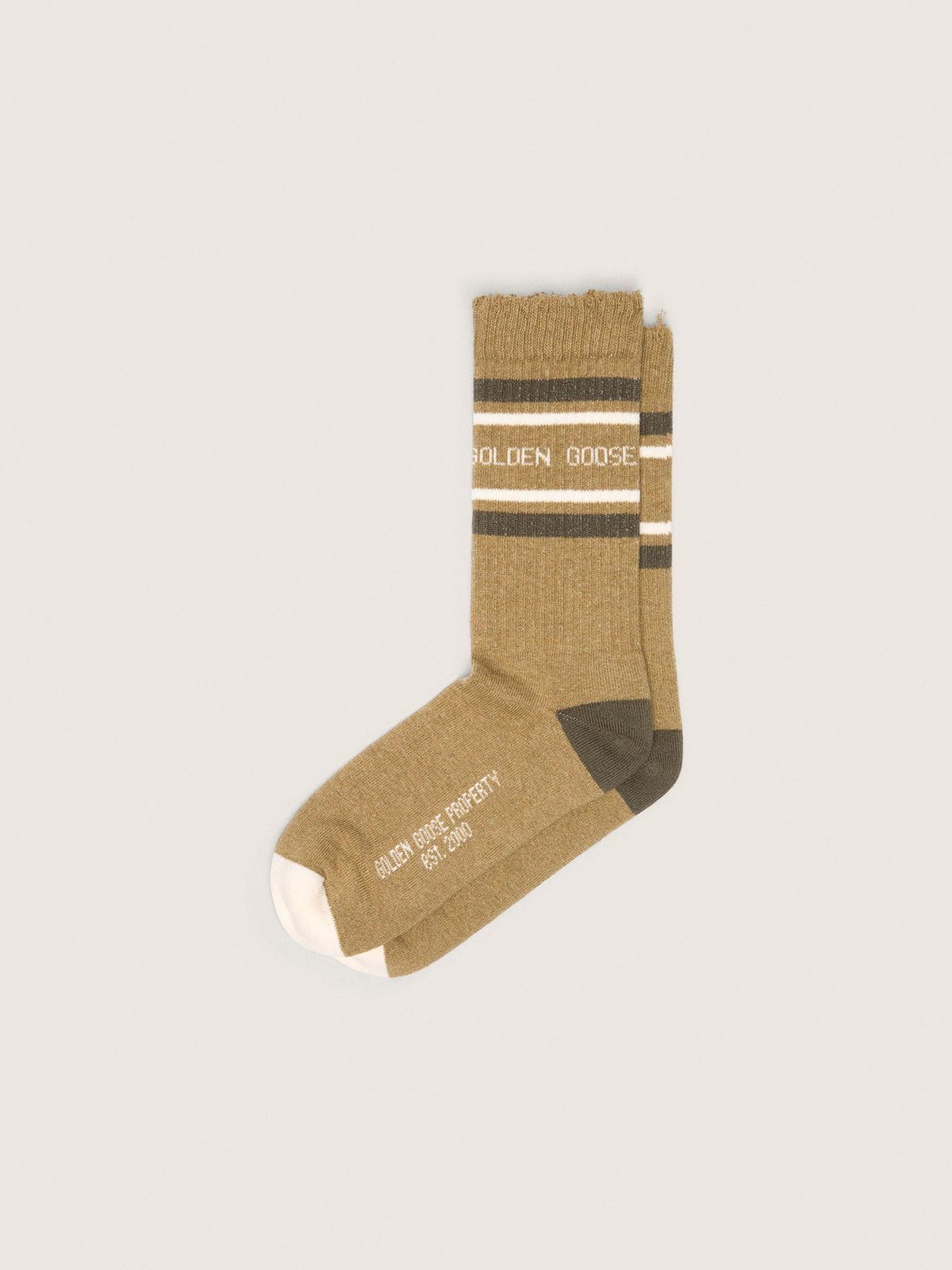 b3fced01c869c38a855e2bd8169ed3387d3f2771c50e42f6cf0b80ccfdc50009 Khaki-colored socks with distressed details and dark green and white stripes - Image 1