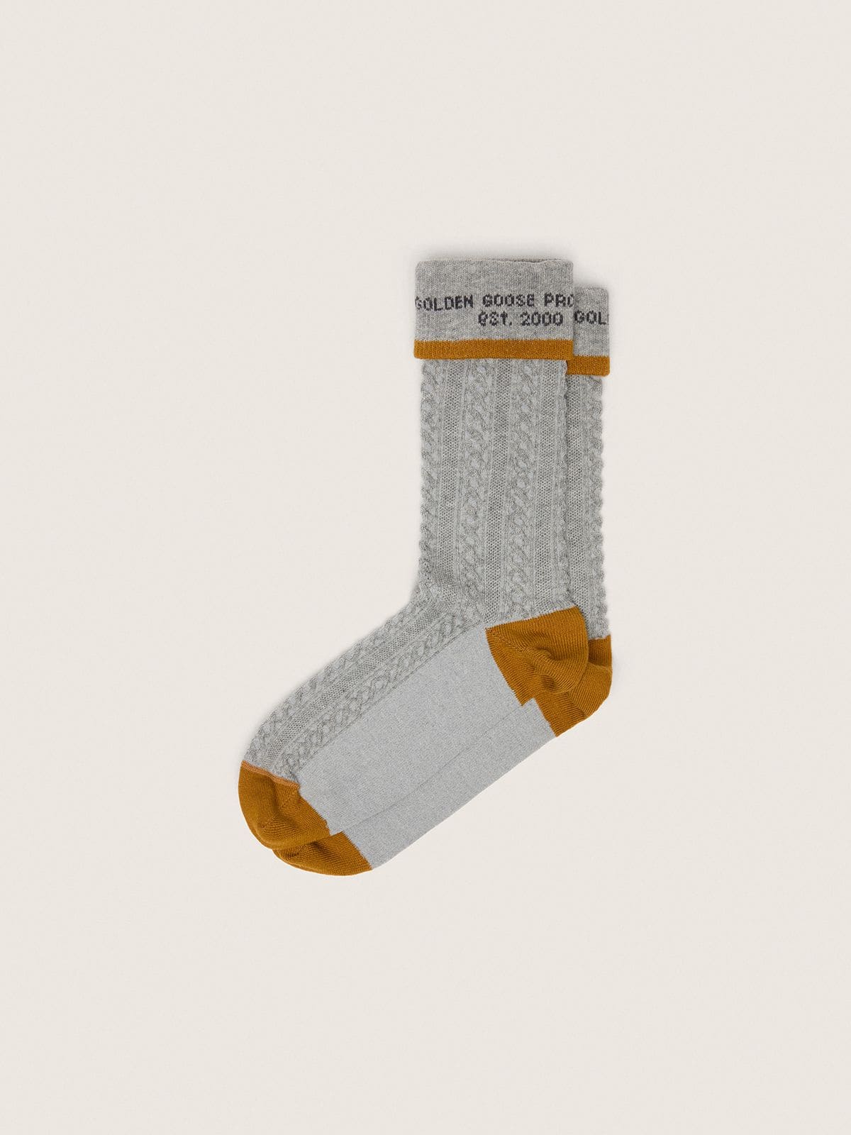 bd31d18e1c3a02eed3b1a1df5b019d1acf986578011200ed397f663f46587f61 Gray socks with turn-up and orange-colored details - Image 1
