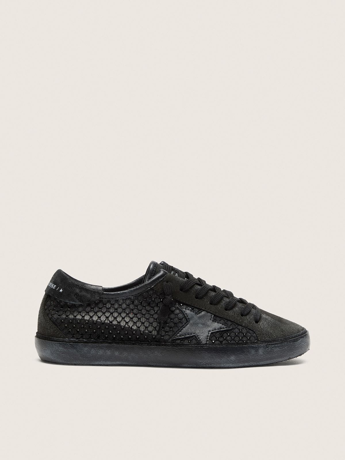 c45e657360d9b89619471313e3b95be27fb7e04ee92c1a48baf99a15257ff71f Women's Super-Star LTD in perforated black suede with black star and crystals - Image 1