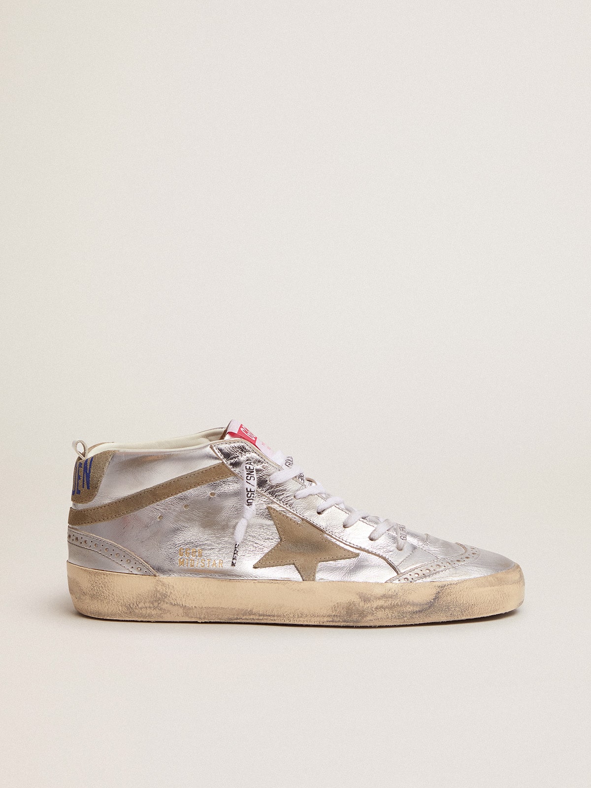 c800c9cd1b64d9a47ea033b9f8ce52c365823728a3ae0cd276c342703c8a2344 Women's Mid Star in silver laminated leather with dove gray star - Image 1