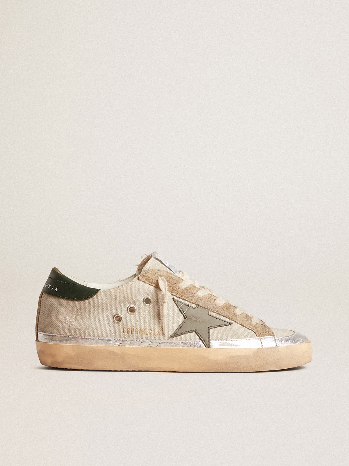 ca4ffb8a1e07dc392733068e78e129af130d36b7c0ec26520b726a6db164910d Super-Star in gray canvas with a green leather star and heel tab - Image 1