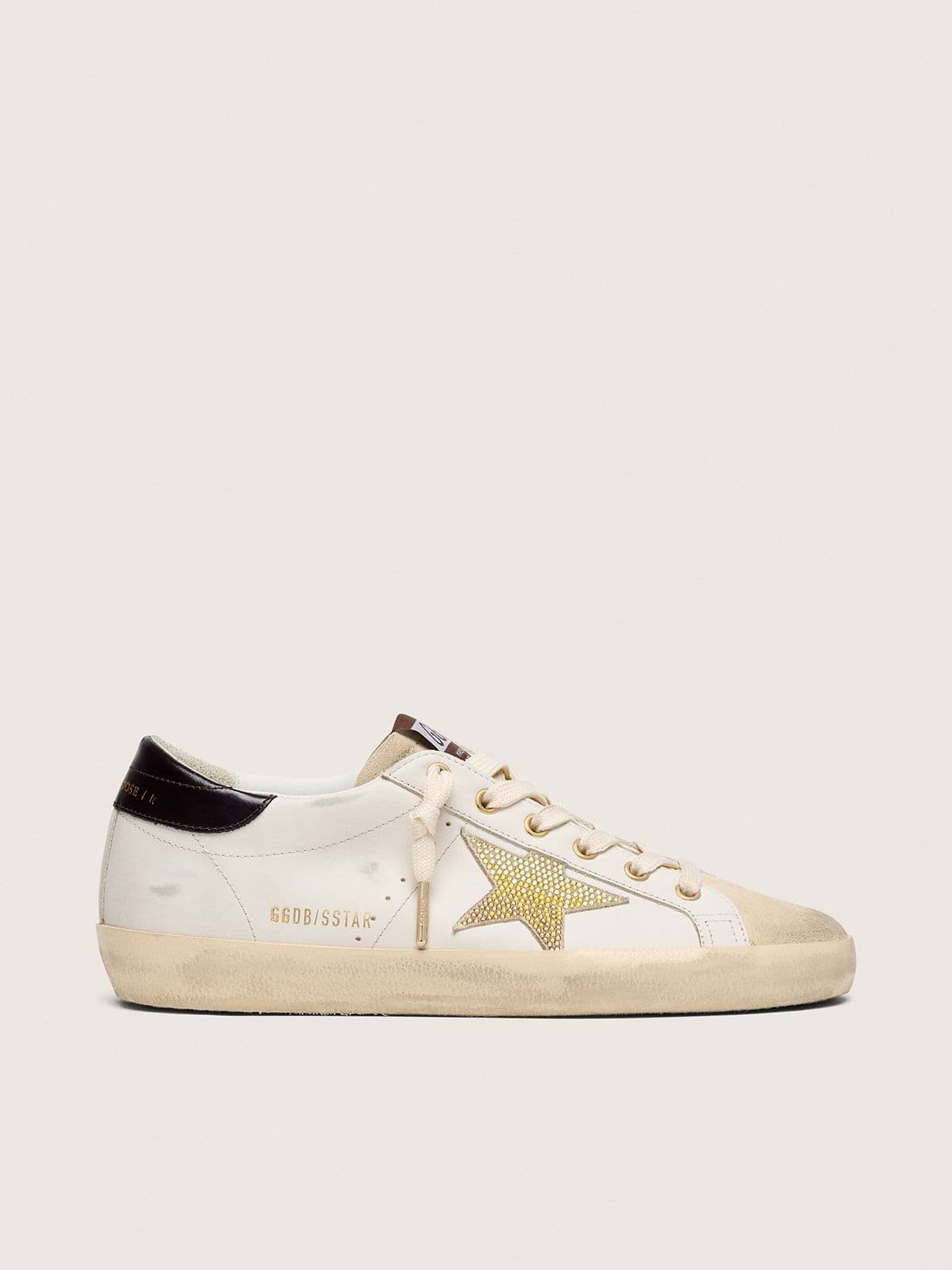 ce386e82a936850cc32abc571c550d7033a6fc6e7fc59a9d0d2b17ccc5900b8c Women's Super-Star in white leather with gold Swarovski star - Image 1