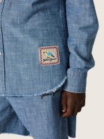 Journey unisex shirt in light blue cotton chambray with fringed hem and embroidered patch - Image 4