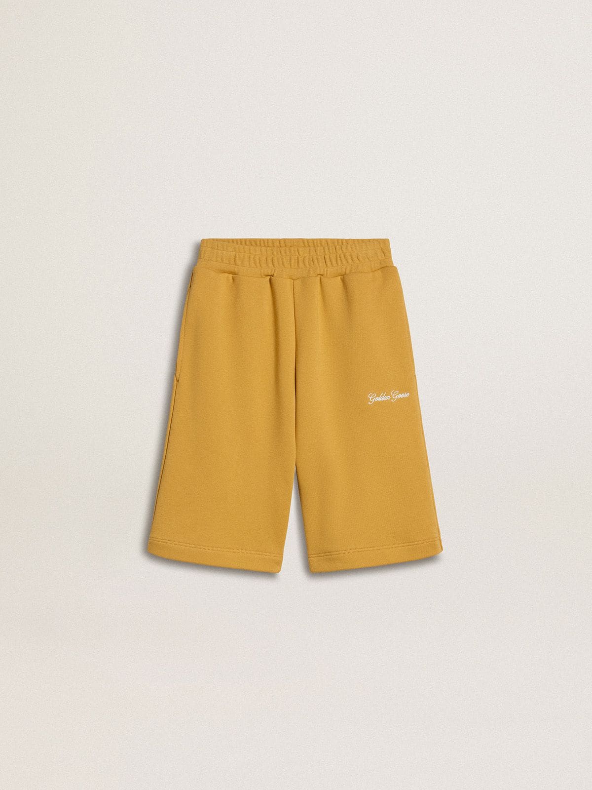 dd10152d8592168c3a333681a15e8cc7a9f9d437092423a84e7777b7cbdf312f Kids jogging shorts in ochre yellow with embroidery - Image 1