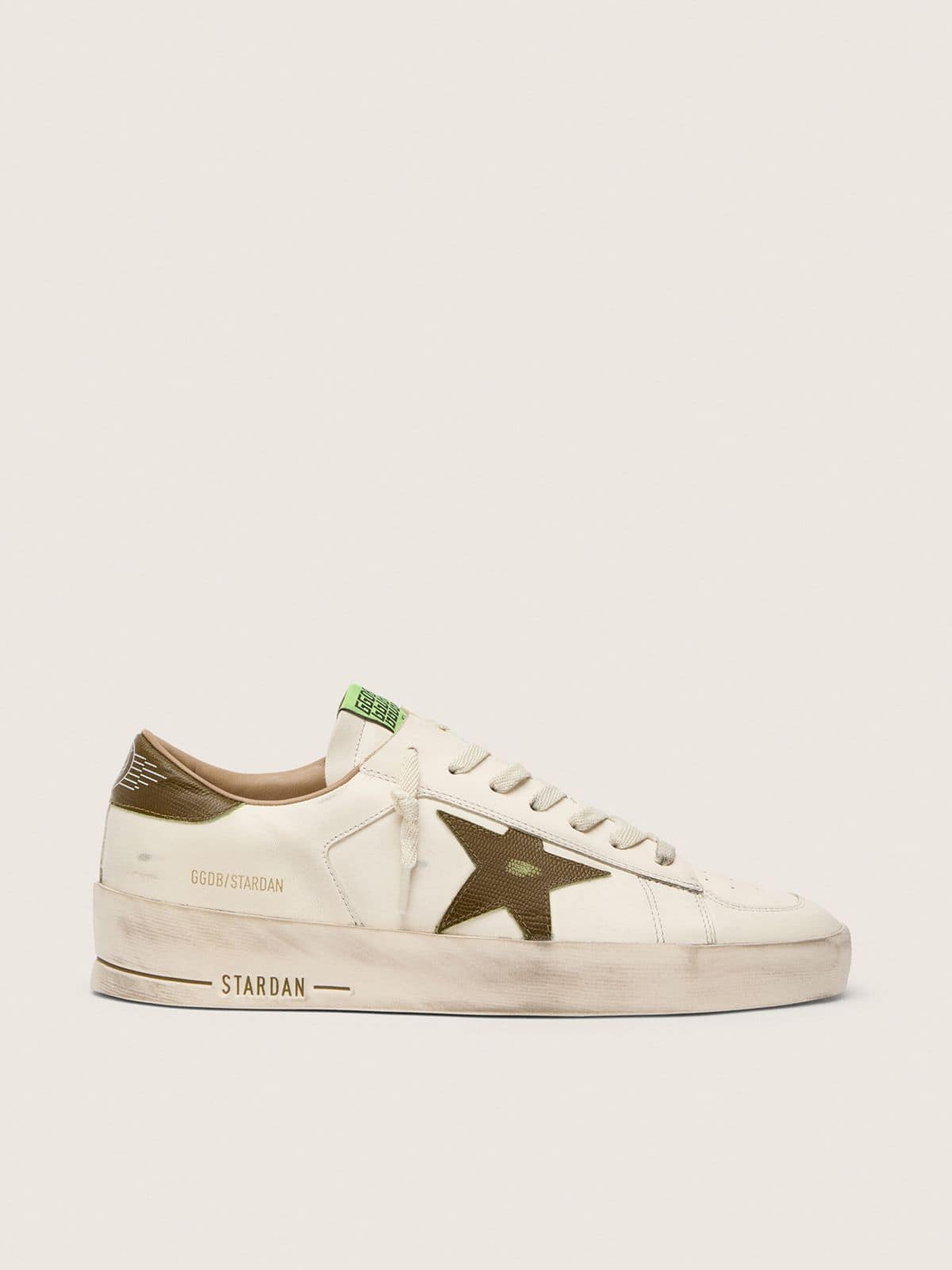 e510a2bdeb1ec43e89ad4e2c8a4889cf2798bd002526f48a7bb211be85880090 Men's Stardan in white leather with military-green snake-print leather star and heel tab - Image 1