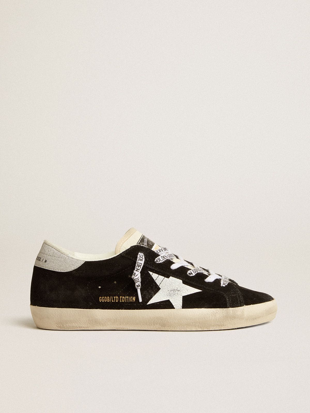 eb678c36c14a5b33a8e39ad2530b19d8f106e5e8c0411cb560daabda6bfd2465 Women's Super-Star LTD in black suede with white printed star and silver glitter heel tab - Image 1