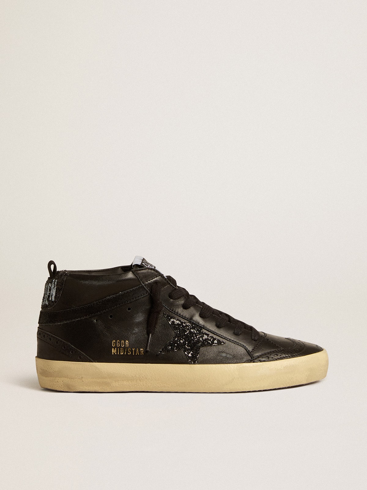 ec2d666a80acbd9d32f39f977c5dd2f75b005847aebe0920979a03dd161cc5f3 Women's Mid Star in black nappa with black glitter star and suede flash - Image 1