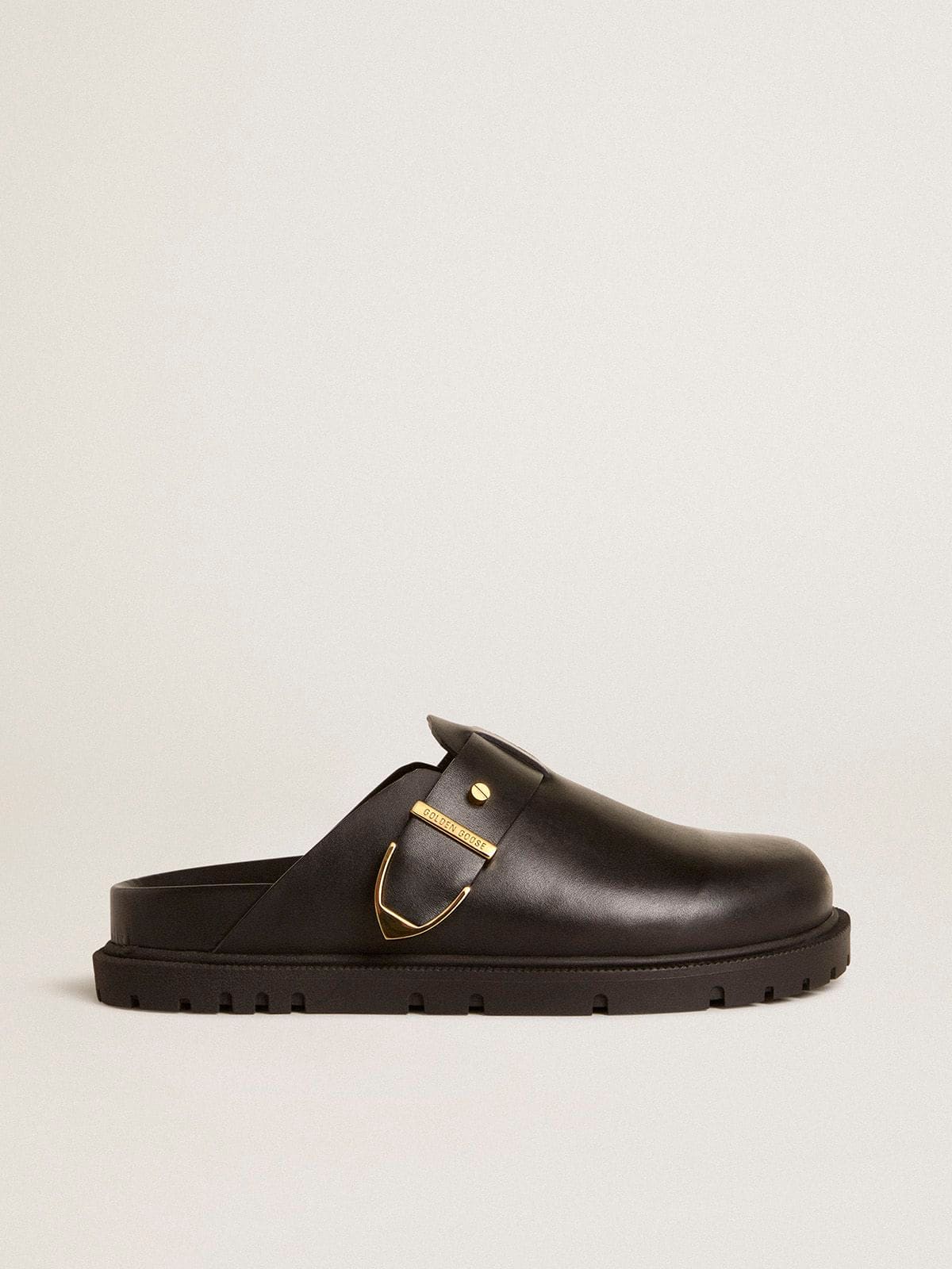 f0cc403c1189c0a163df1399e58cc6d5510488dfe5c383621200f04098f2113e Women's Lucy Sabot in glossy black leather with gold metal buckle - Image 1
