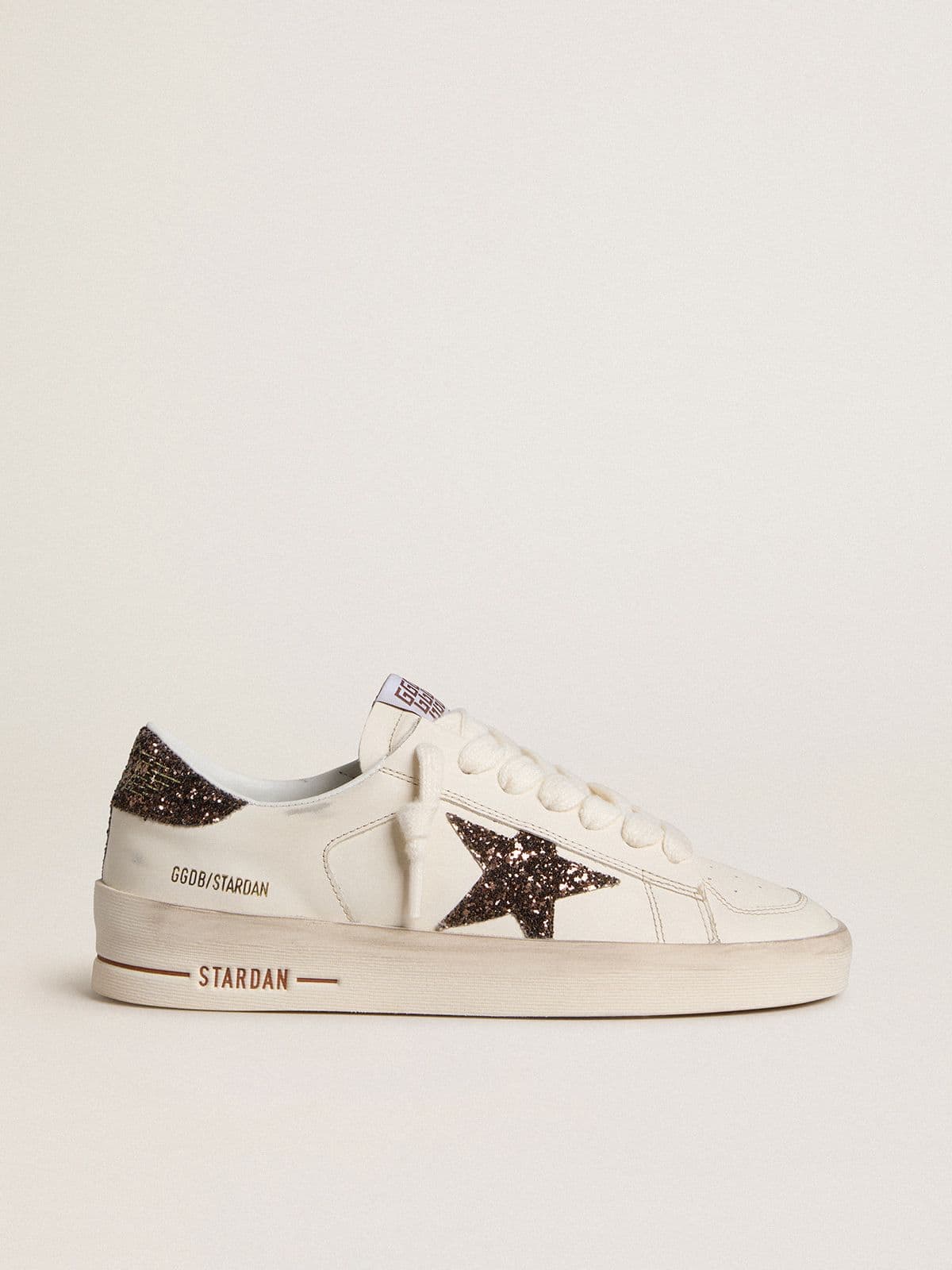 f69bd34b0f9a38da2226730c2f5d6b8a934d85144222a215fb7940a8de20d22f Women's Stardan in white leather with brown glitter star and heel tab - Image 1