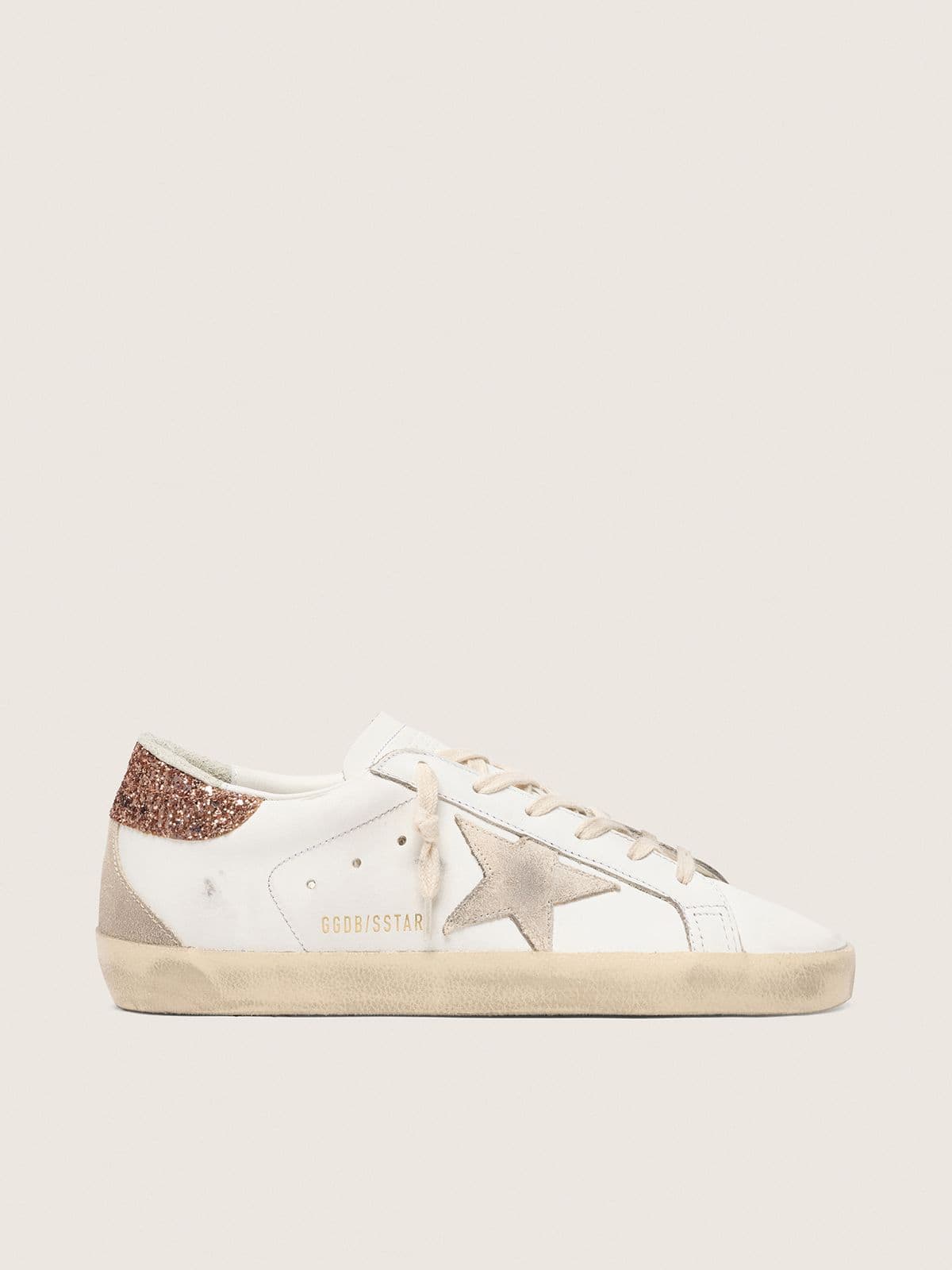 f7d2a4275960c3a3efa774600439ddbf3e24f085e80ce16bcfd6ec84d7cea2b1 Women's Super-Star with a suede star and peach-pink glitter heel tab - Image 1