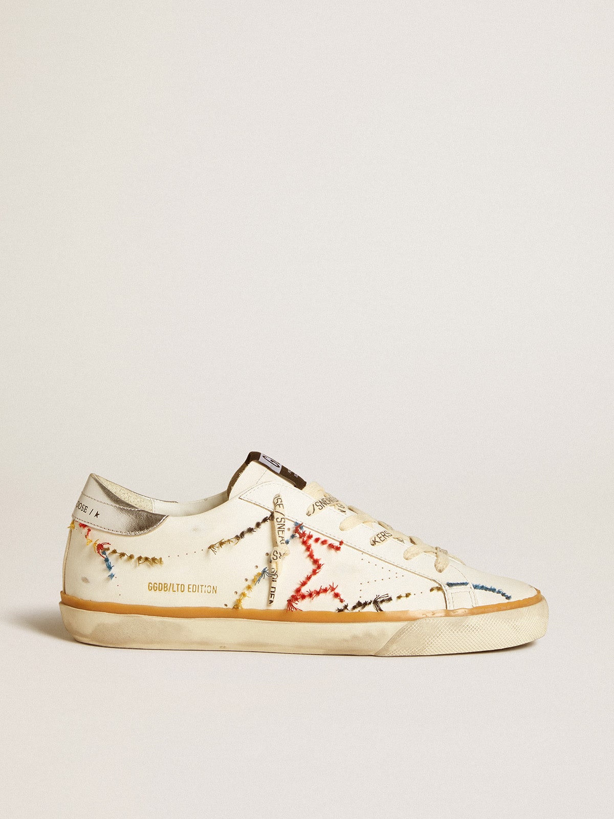 f8f4247f28ca5255155fcaadfb7c08676aa0cd7be8172917adaf662181b94d05 Women's Super-Star LTD with perforated star and metallic leather heel tab - Image 1