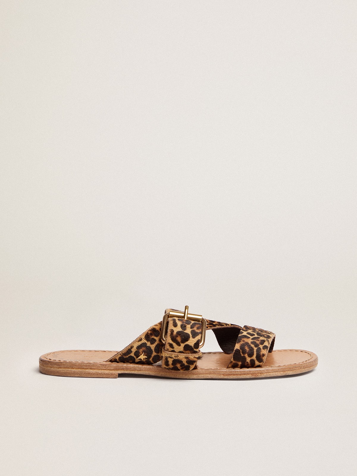 f8ff9d4c083d334f4e60820cc1855bbf11c5ea3a242a6f2039fa260e2efc676b Women's Margaret flat sandals in leopard-print pony skin - Image 1
