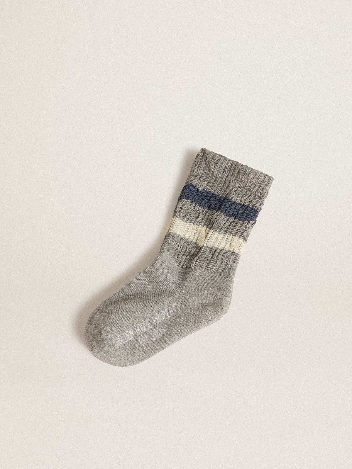 fa8c9de4d24bddf66ae3129cdd5305334a7916e8a73e7c24475585ee7a810b83 Kids' gray socks with distressed details and worn-white and blue stripes - Image 1