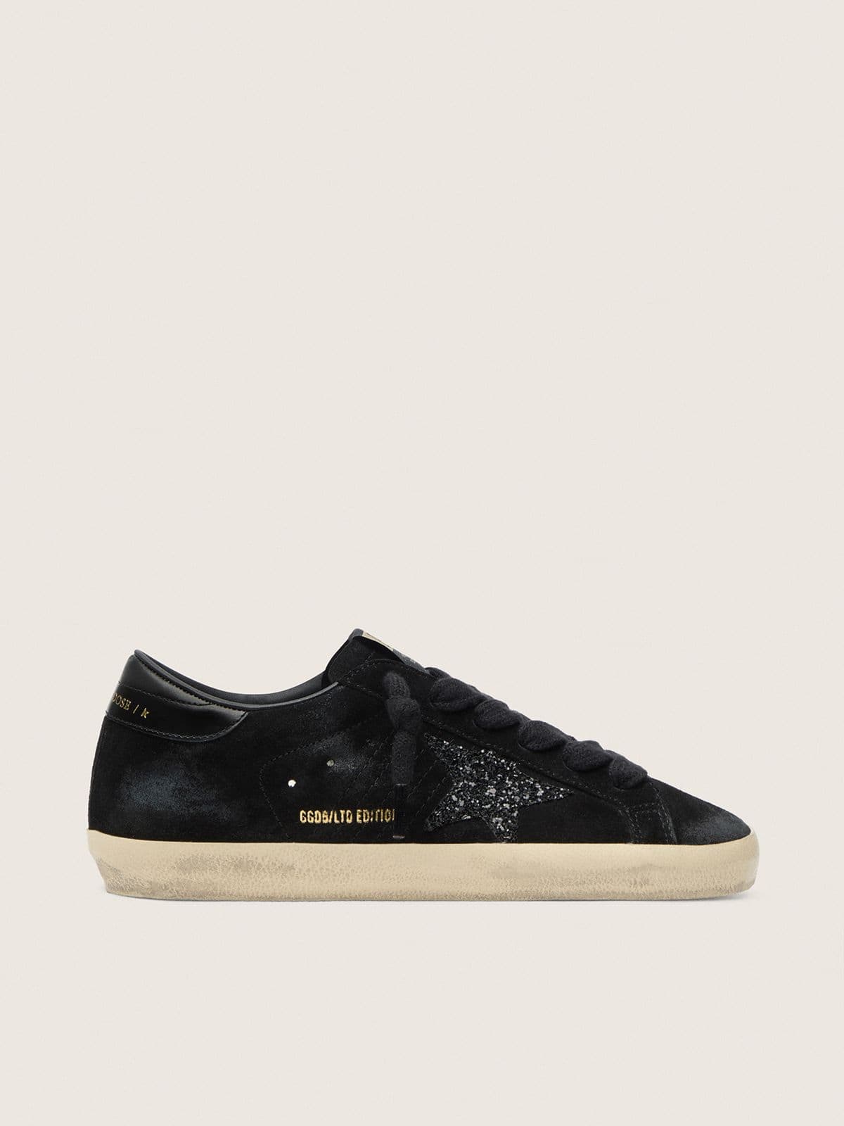 fc9e4245fa461377698d7bf6ad9b174406ea5fe8697bd2270549eebb0c25198e Women's Super-Star LTD in black suede with black glitter star and black leather heel tab - Image 1