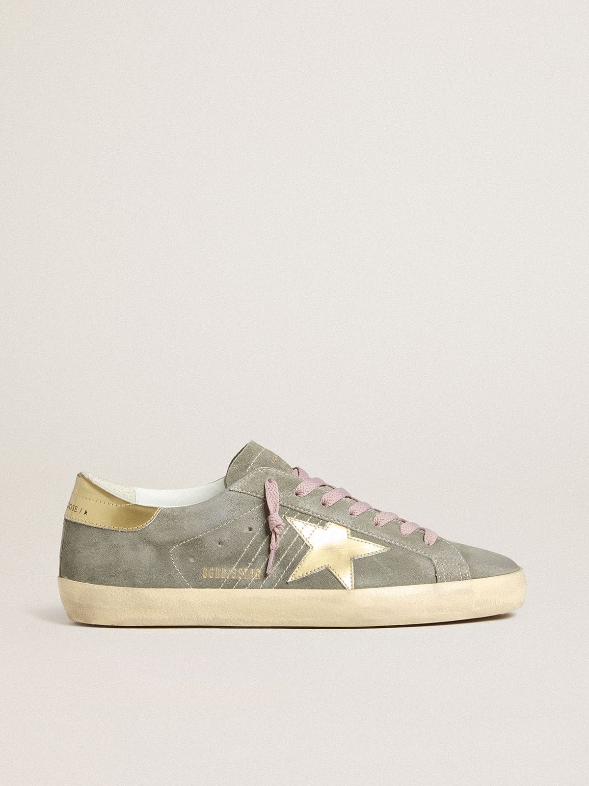 fe357497e1688e5a5f66fc647d1e14fad548cc89d27e27a51e3c2db7f50e5816 Men's Super-Star in gray suede with gold metallic leather star and heel tab - Image 1